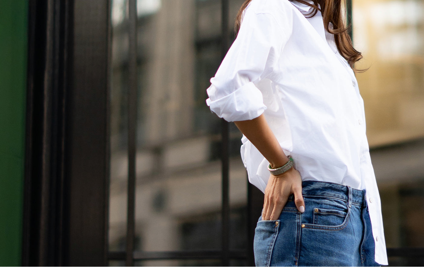 VANA Mint Stacker diamond bracelet worn with a white shirt and jeans outdoors